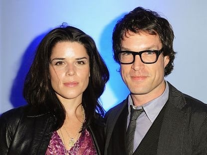 A picture of Neve Campbell with John Light.